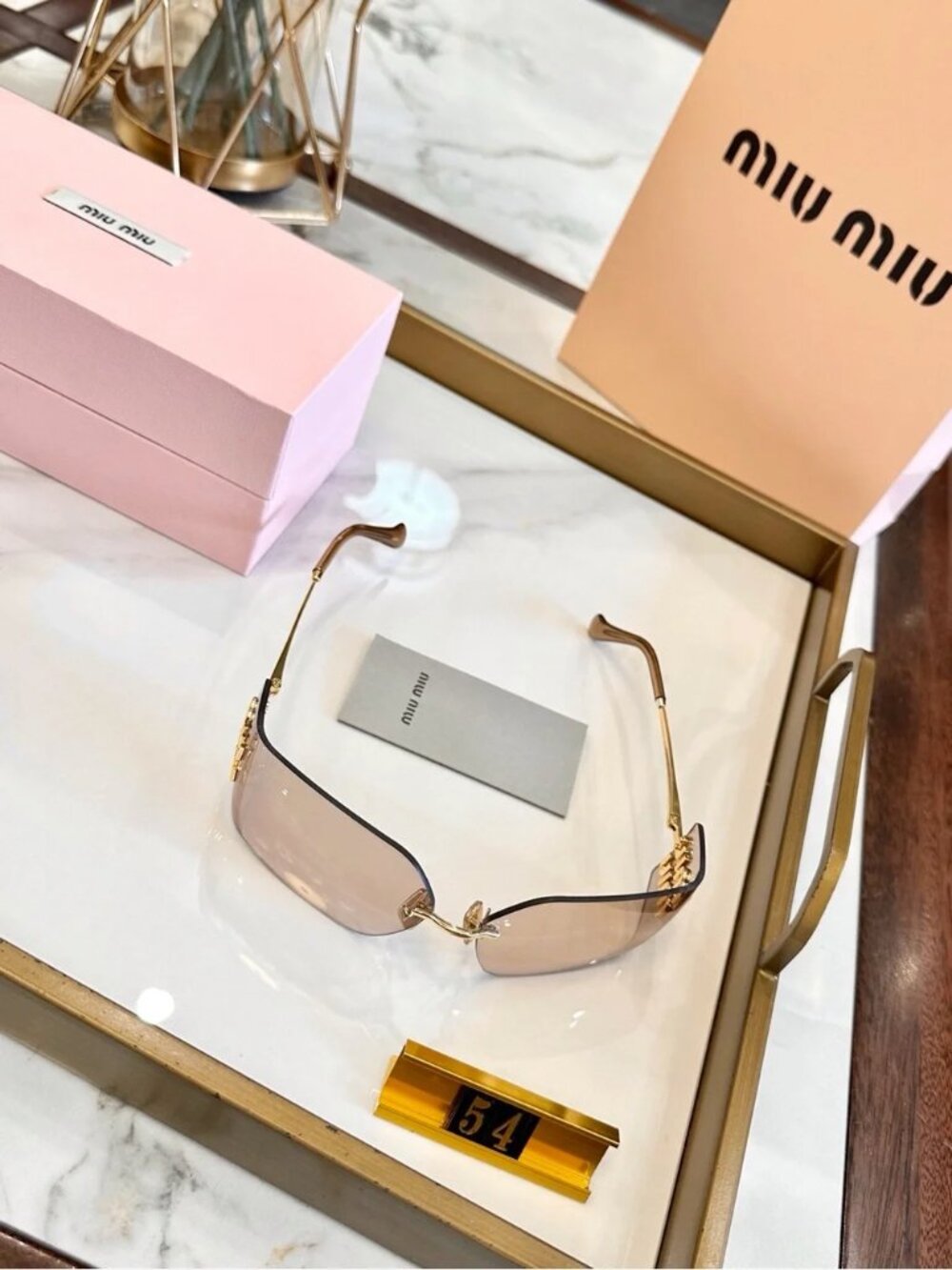 Miu Miu Rimless Sunglasses with Pink-Brown Lenses and Gold Accents - Picture 4 of 7
